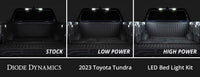 Comparison of Diode Dynamics LED bed light kit on a 2023 Toyota Tundra with 'Stock', 'Low Power', and 'High Power' labels.