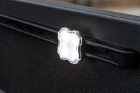 Diode Dynamics LED rock light mounted to Toyota Tacoma bed rail