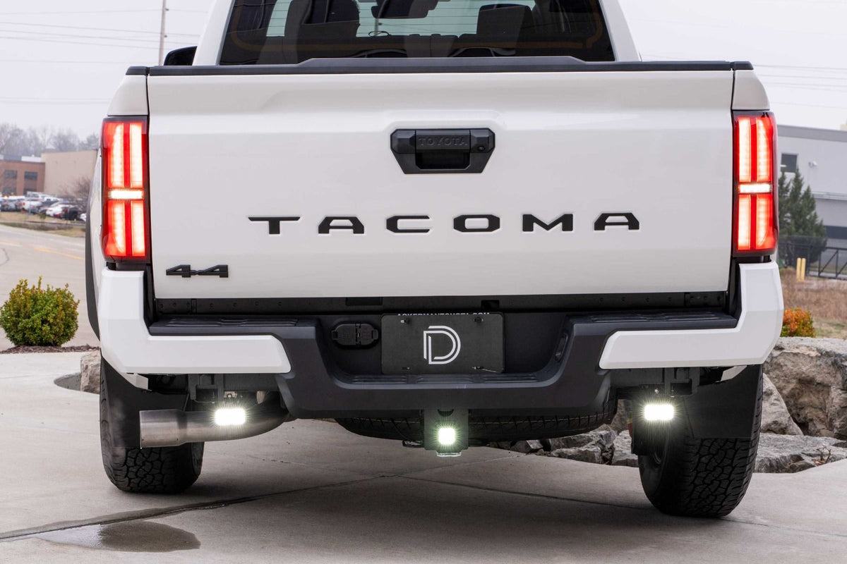 Diode Dynamics Stage Series LED pods mounted under Toyota Tacoma rear bumper