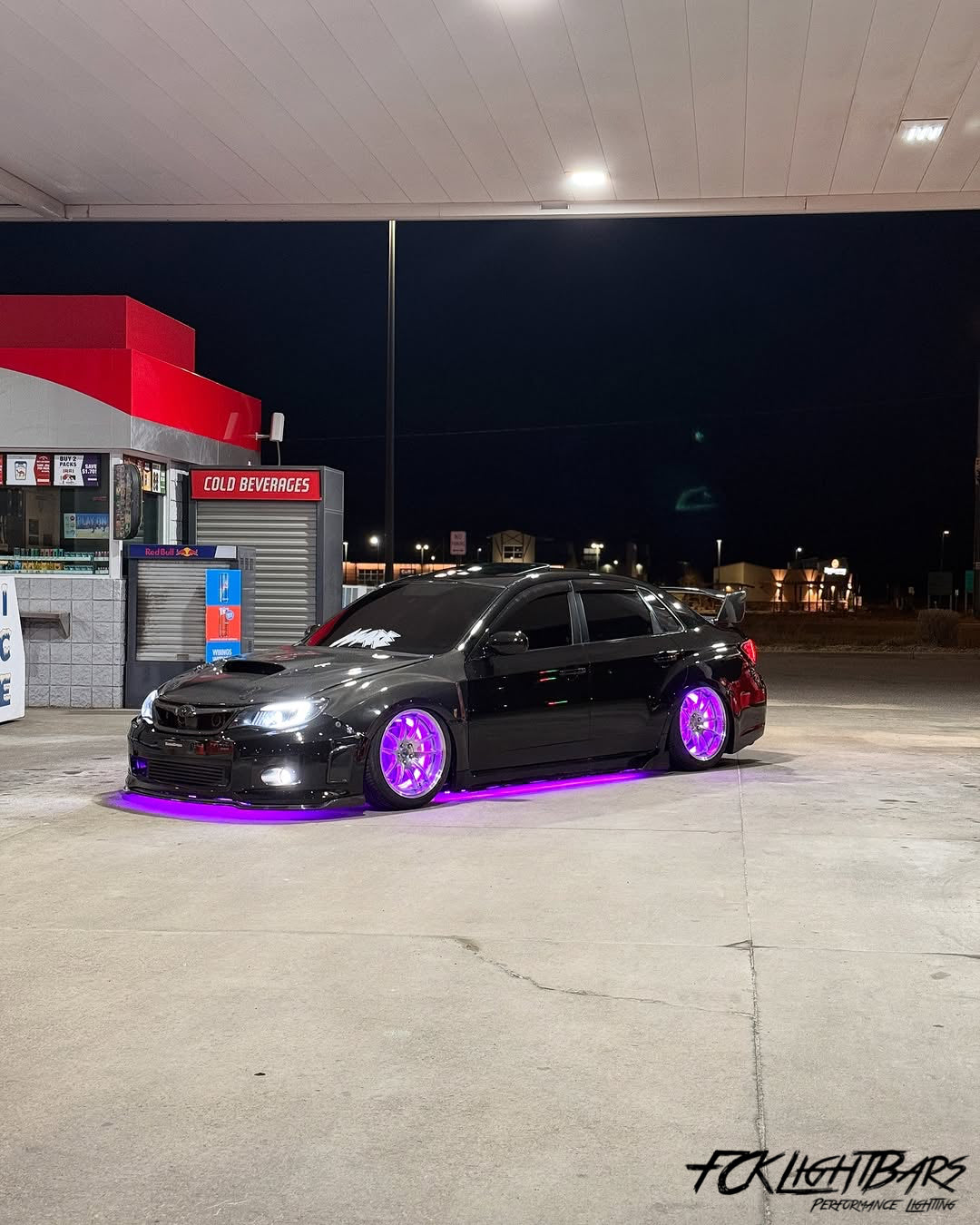 Under Glow LED Strip Kit RGB+W on an violet and black car