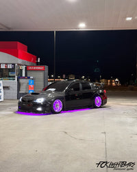 Under Glow LED Strip Kit RGB+W on an violet and black car