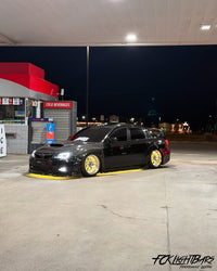 Under Glow LED Strip Kit RGB+W on an yellow and black car