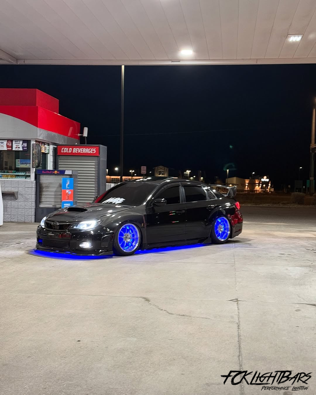 Under Glow LED Strip Kit RGB+W on an blue and black car
