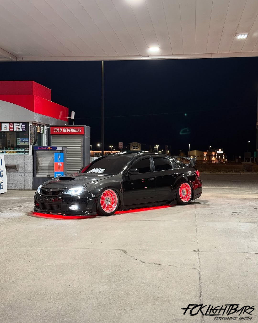Under Glow LED Strip Kit RGB+W on an red and black car
